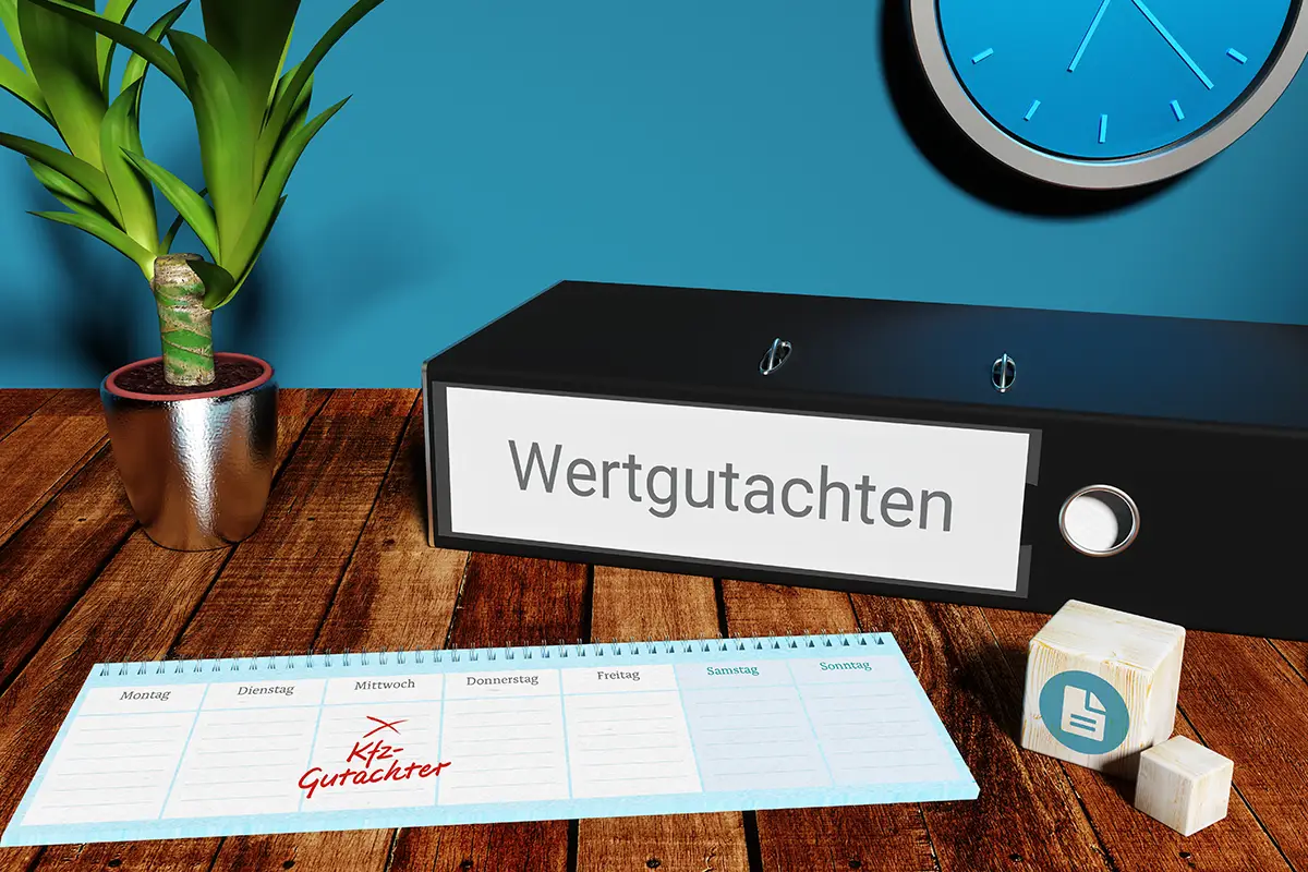 Ein Ordner auf dem Wertgutachten steht und ein Terminkalender in dem ein Termin beim KFZ-Gutachter notiert ist